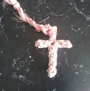 A white and pink cross
